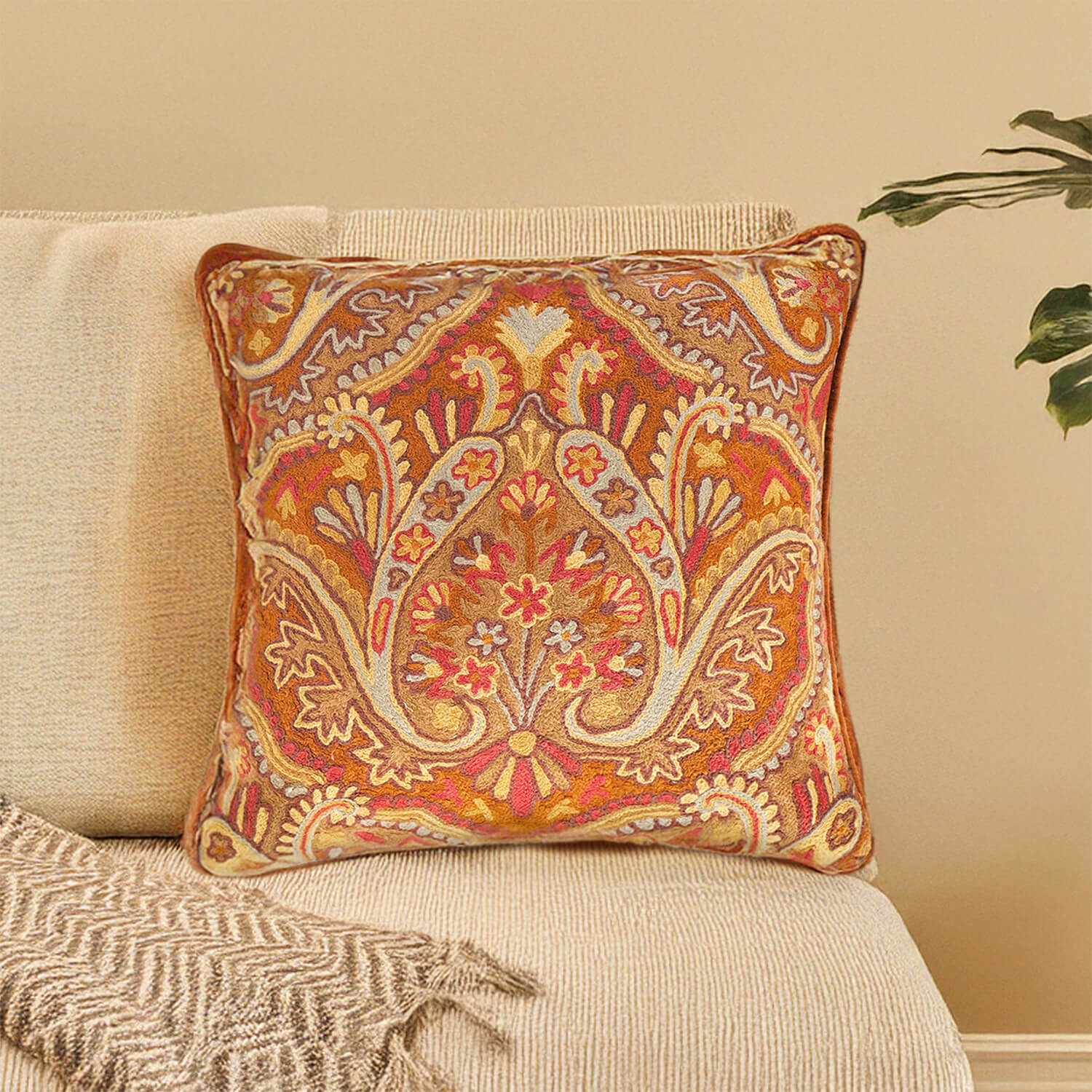Decorative cushion with a stylish design placed on a sofa.