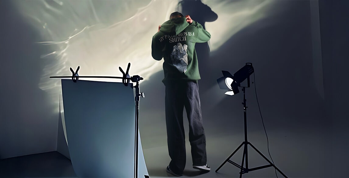Studio photoshoot with artistic lighting creating a dramatic effect.
