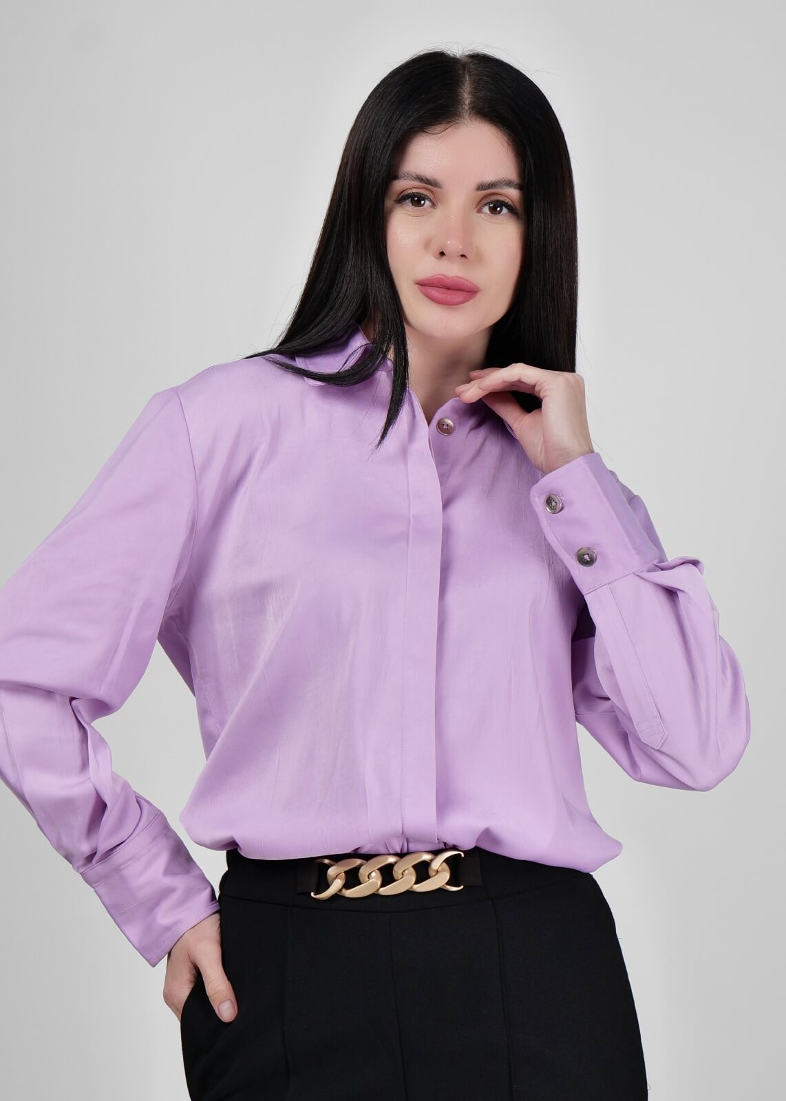 Model in a stylish shirt posing for a fashion photoshoot