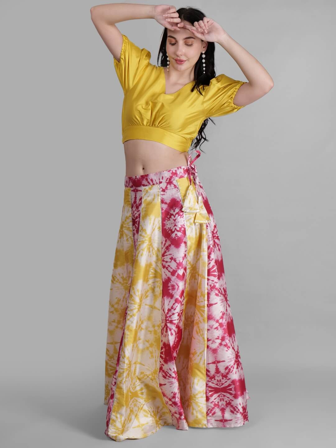 Model wearing a traditional outfit posing for a fashion photoshoot