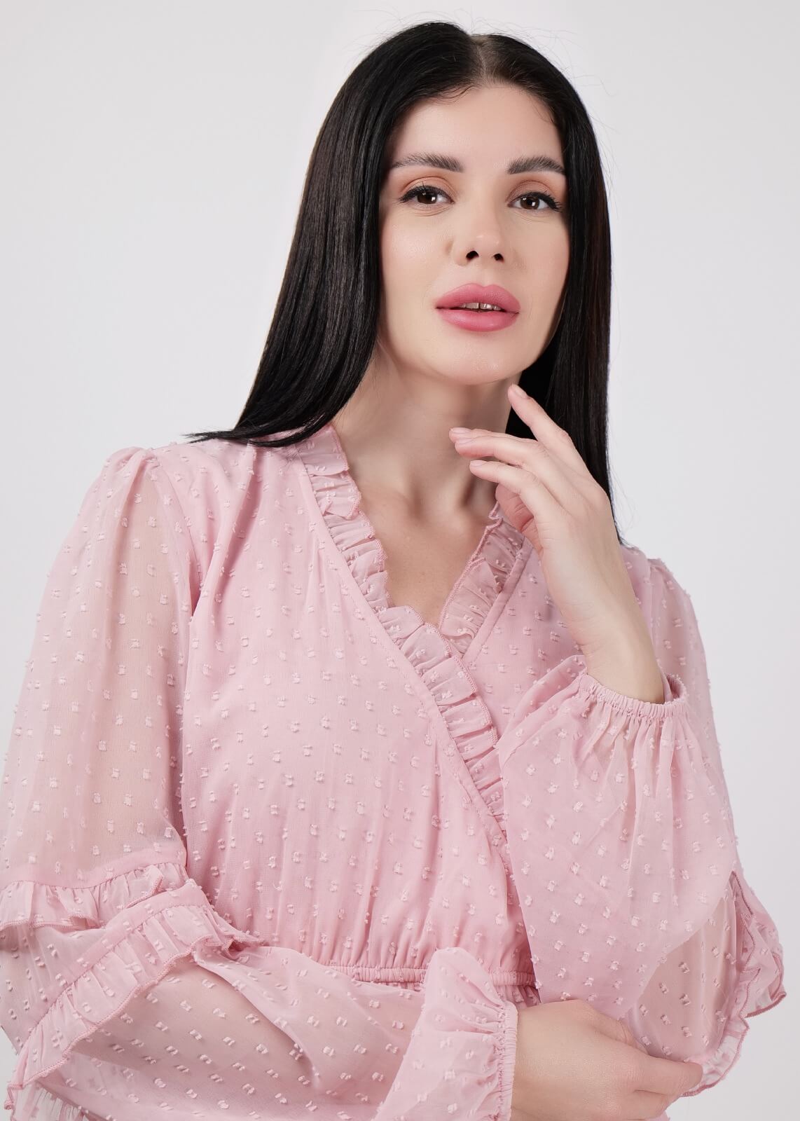 Model wearing a trendy top posing for a fashion photoshoot